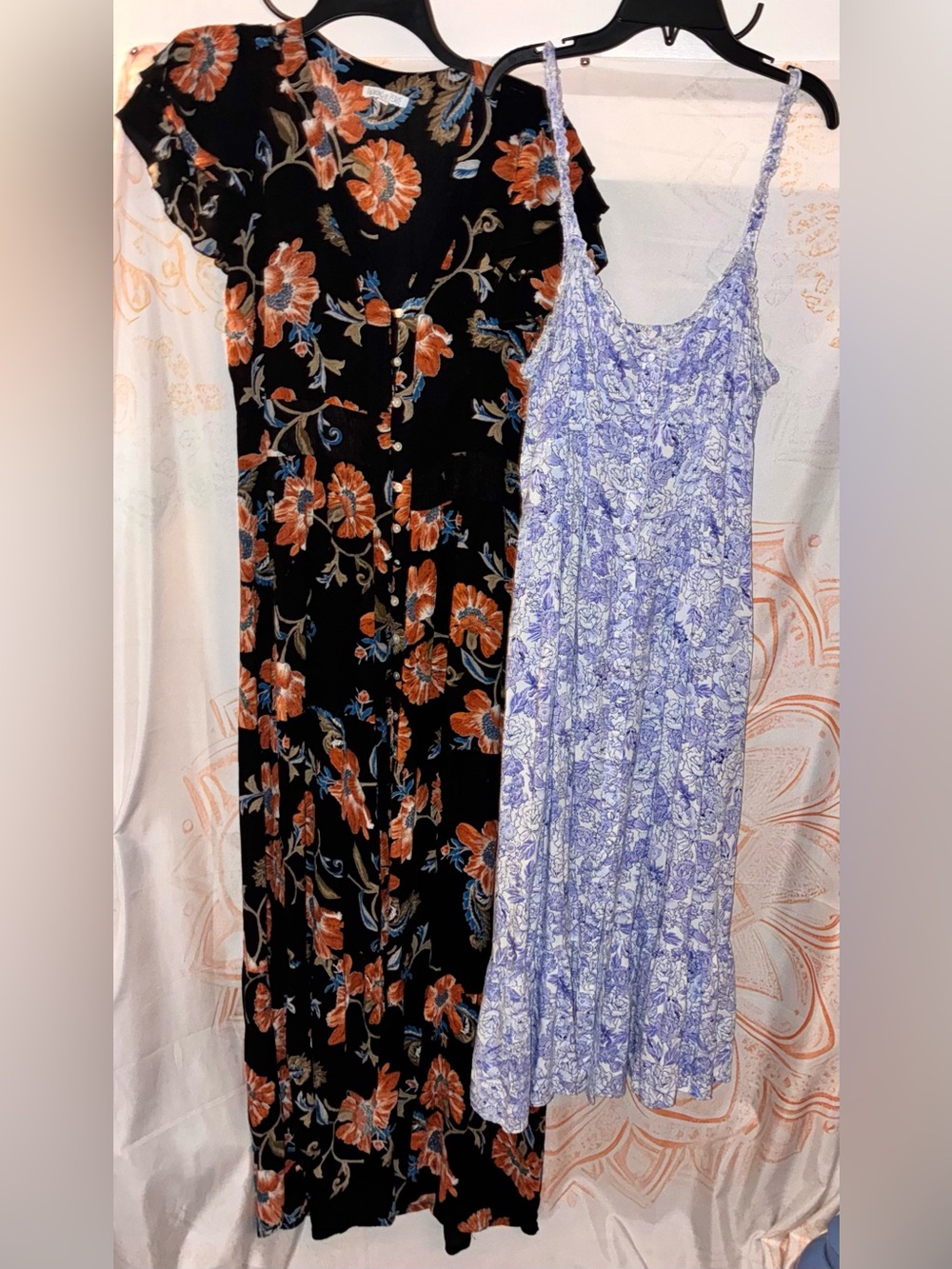 Patrons of Peace Bundle Featuring a Blue Floral Dress & a Black Floral Dress